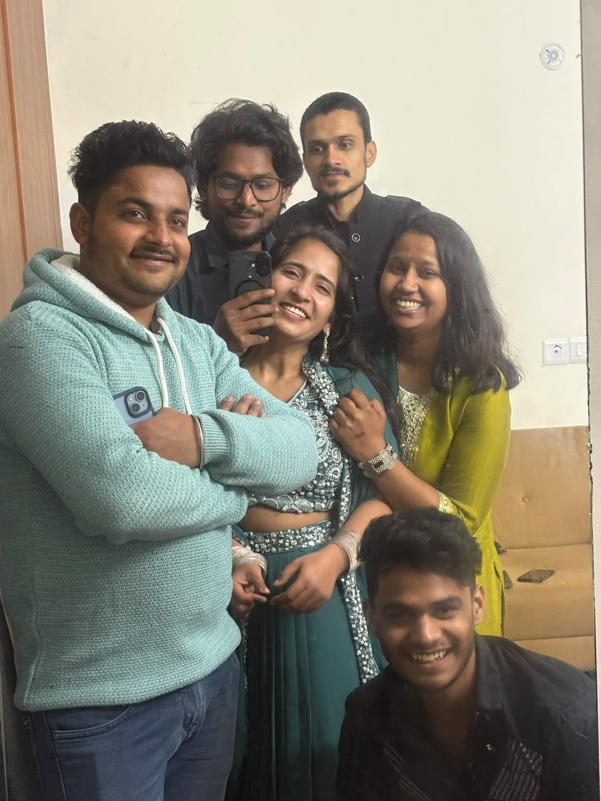 Team celebrating a milestone at office desk with balloons