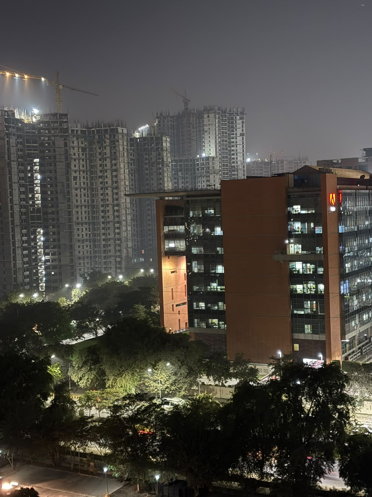 Night skyline of Adobe corporate building near Jaypee Wish Town