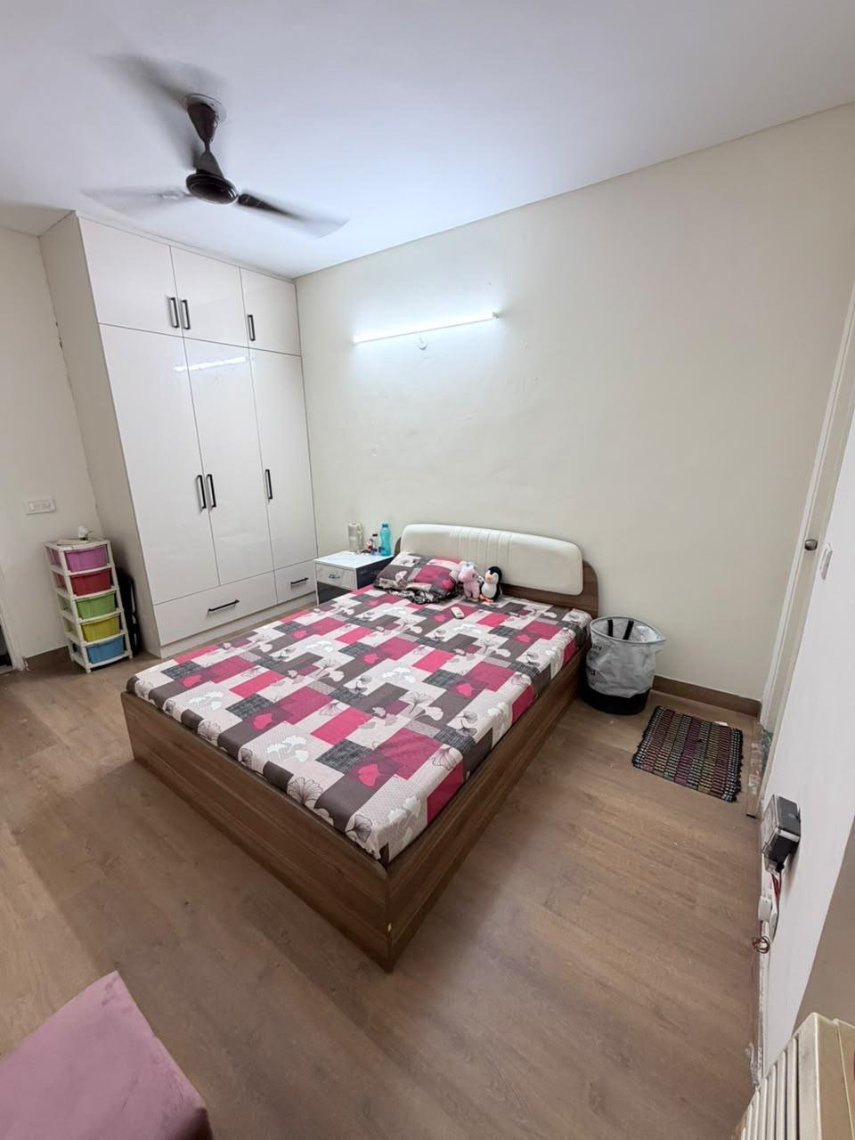 White-themed bedroom with modern wardrobes