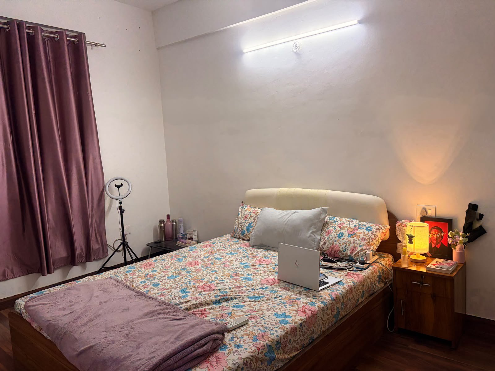 Cozy master bedroom with warm lighting and work-from-home desk
