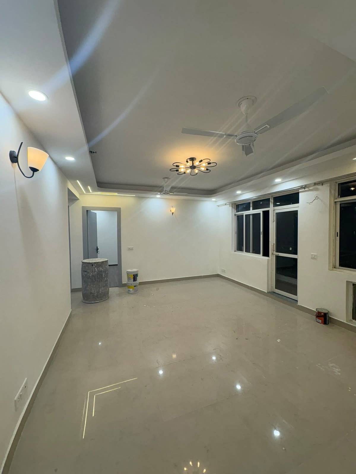 Freshly renovated living hall with chandelier